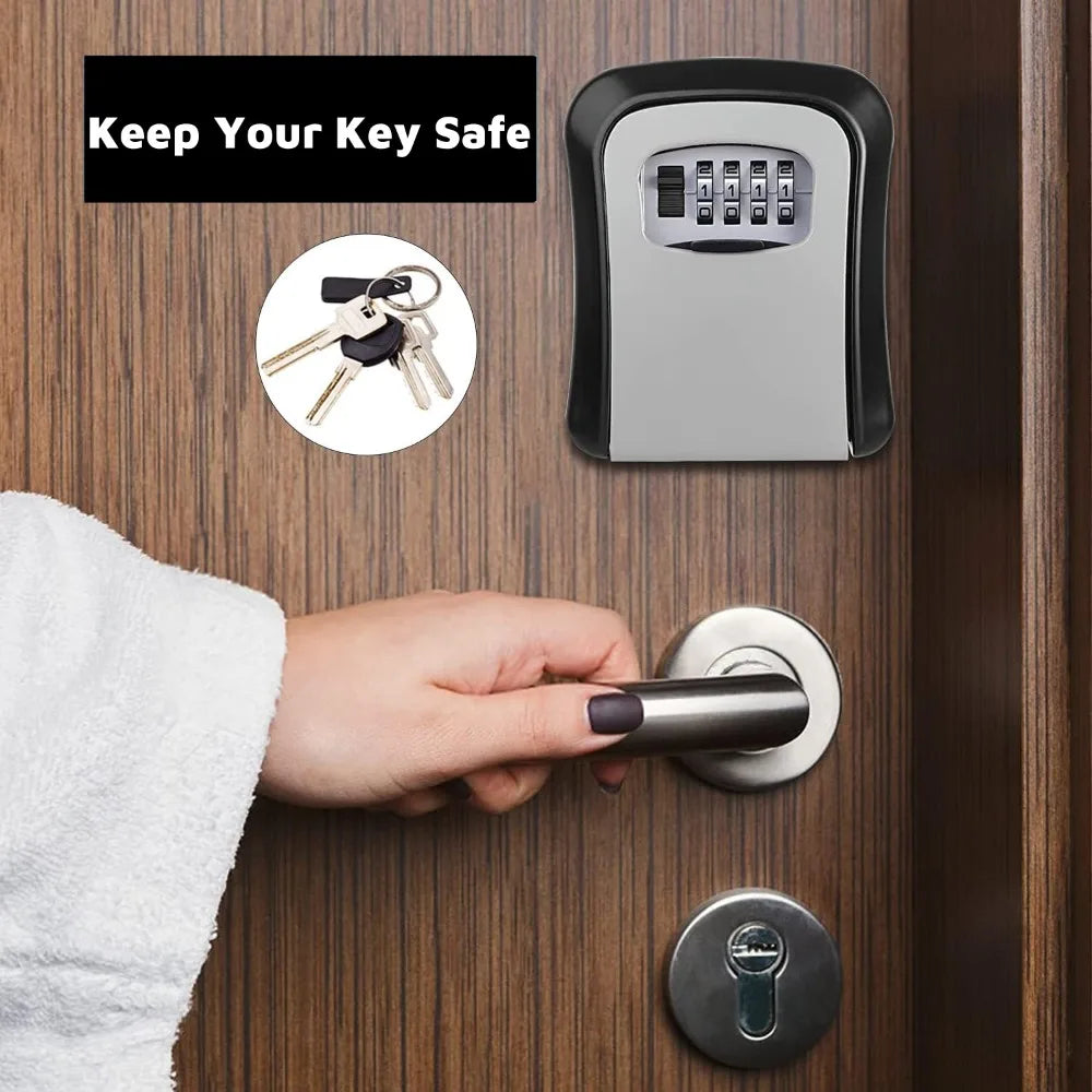 Black and silver metal wall-mounted key lock box with a four-digit combination dial, mounted on a wooden door.