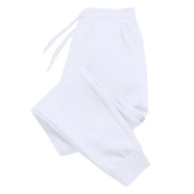 White casual joggers with an elasticated drawstring waistband and cuffed hems.