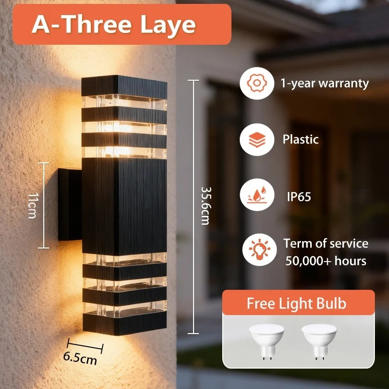 Modern black rectangular outdoor LED wall light with warm up-and-down lighting, mounted on an exterior wall.