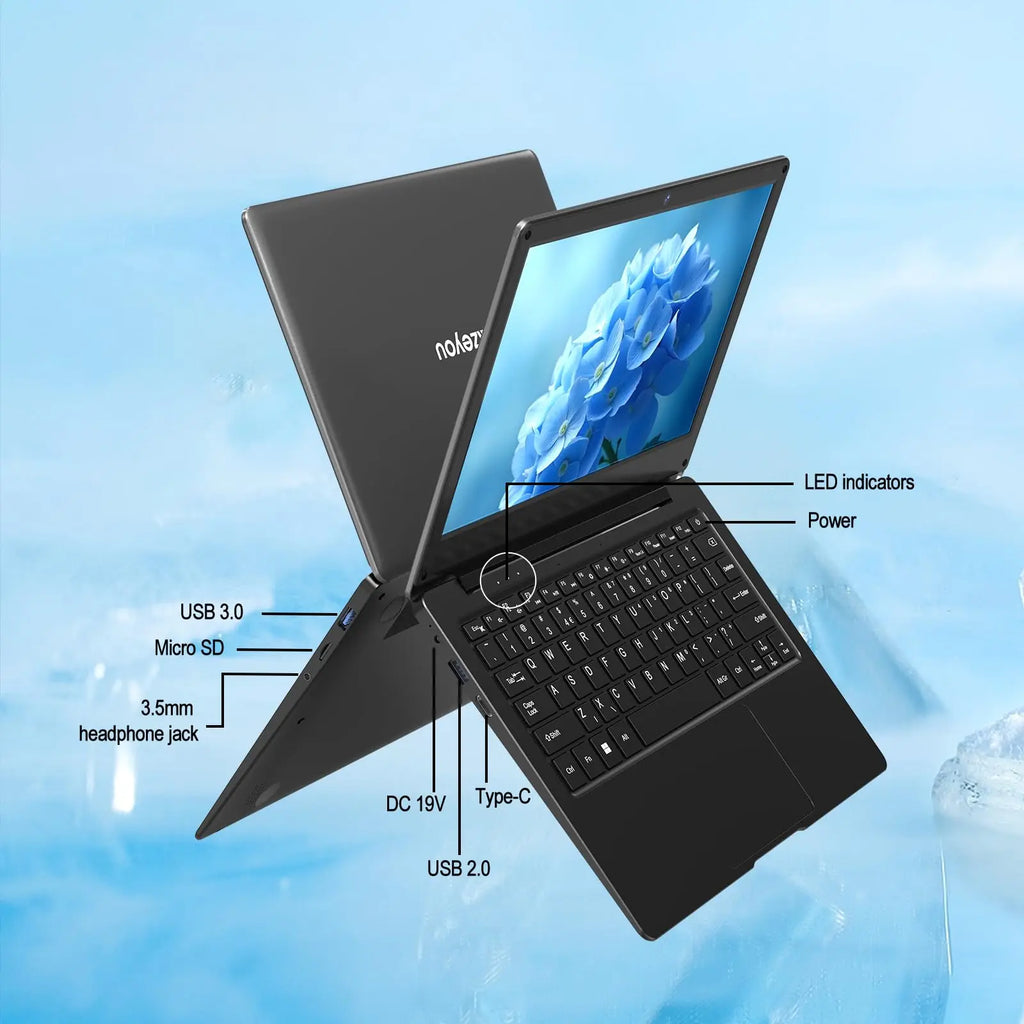 Slim 11.6-inch grey laptop showing ports including USB 3.0, Type-C, headphone jack, and keyboard layout.