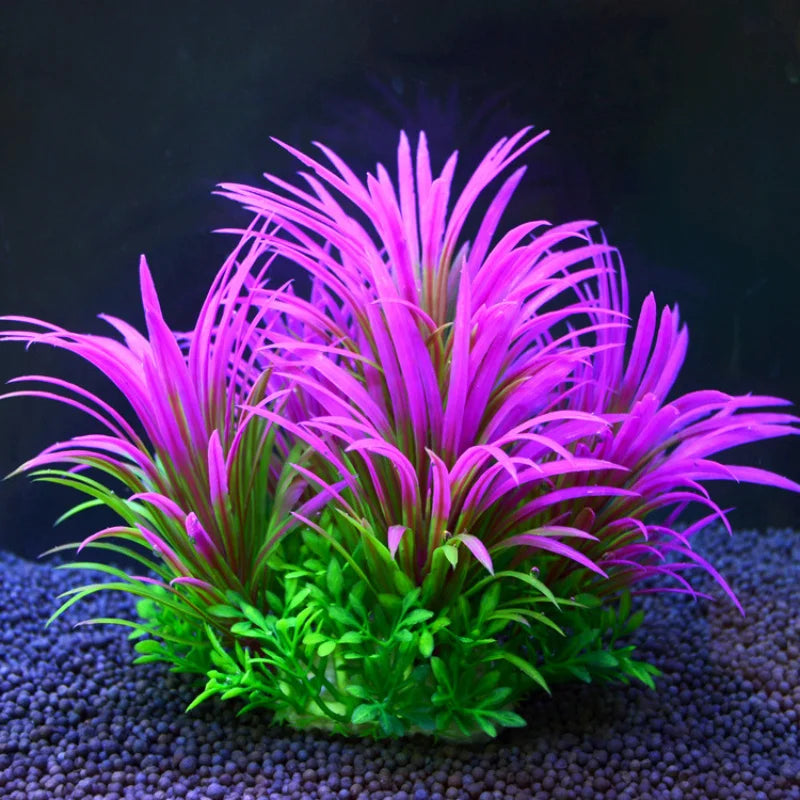 Artificial aquarium plant with vibrant purple, spiky leaves rooted in a green base on dark aquarium substrate.