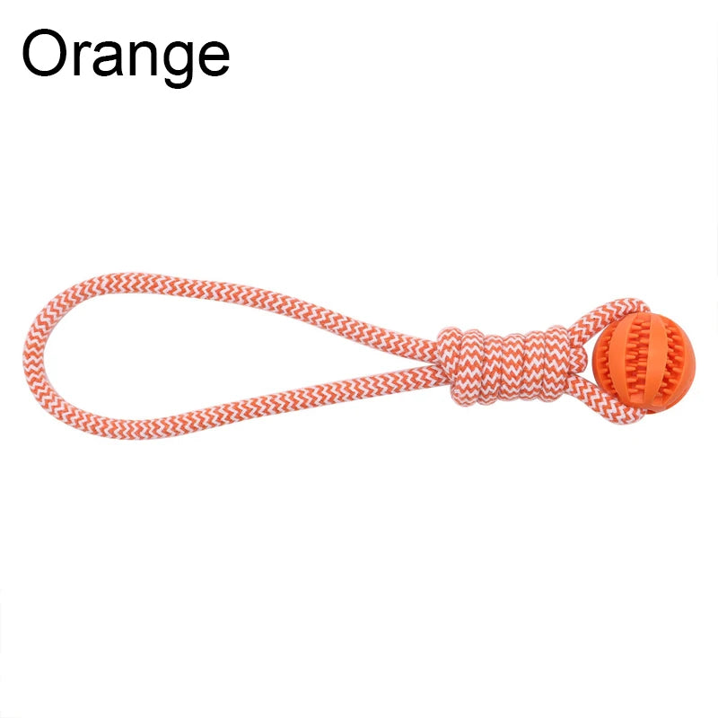 Orange dog toy featuring a durable woven rope loop attached to a rubber treat-dispensing ball.