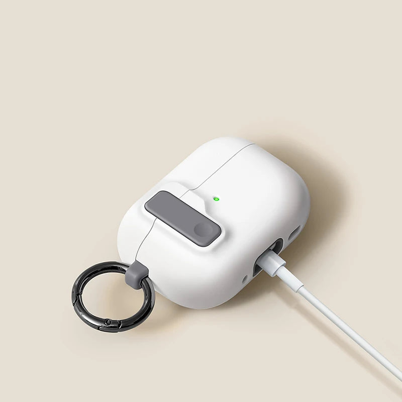 White silicone protective case for AirPods Pro, featuring a grey latch, charging port cutout, and black keyring.