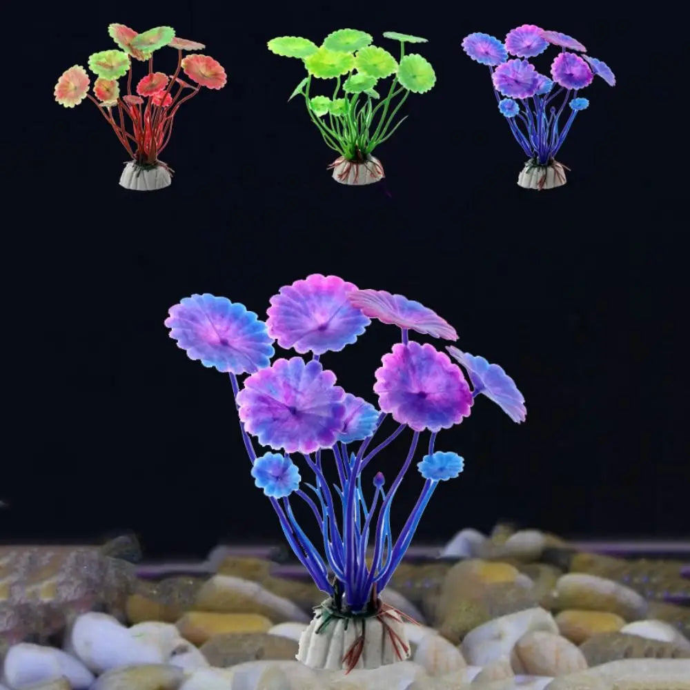 Artificial aquarium plants with round, flat-topped leaves in red, green, and purple, set on a white rock base.