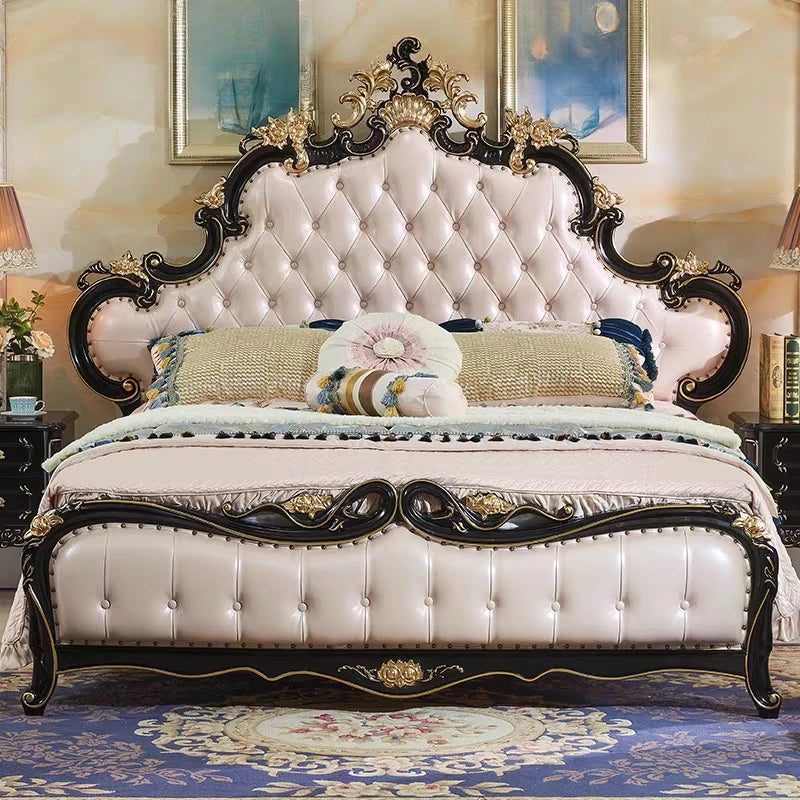 Ornate double bed with a cream, button-tufted padded headboard, black wood frame, and gold carved detailing.