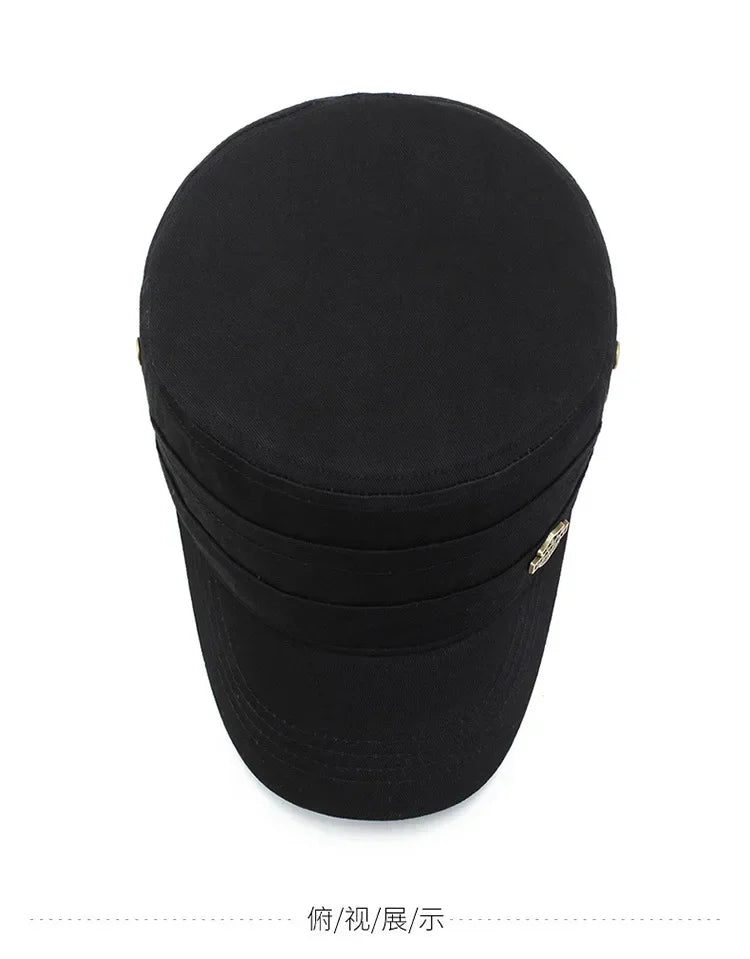 Top-down view of a black unisex military-style cotton cap with a flat top, short brim, and small side metal detail.