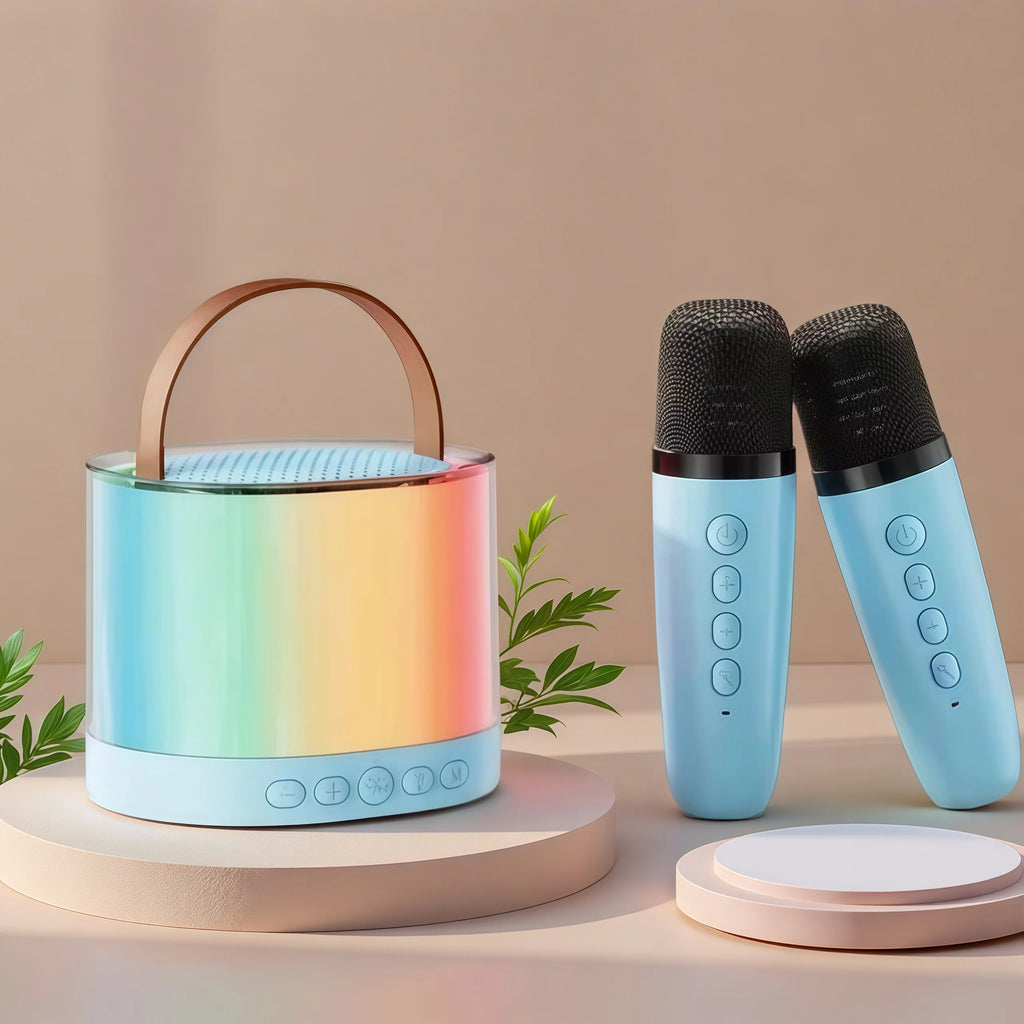 Portable light-blue karaoke speaker with a rainbow RGB glow, leather carry handle, and two matching wireless mics.