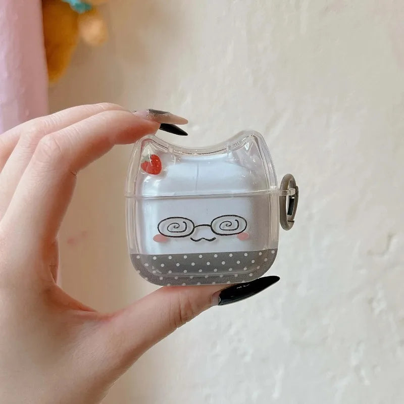 Clear, cat-ear silicone case for AirPods with cute glasses and strawberry print, held in a hand.