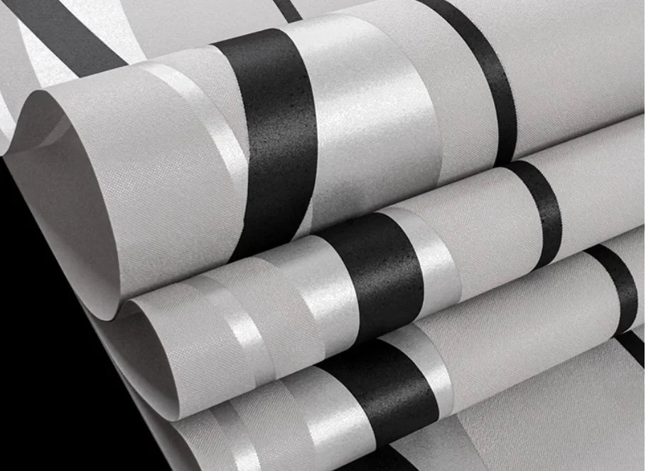 Modern wallpaper featuring bold black and grey geometric stripes with a subtle textured finish.