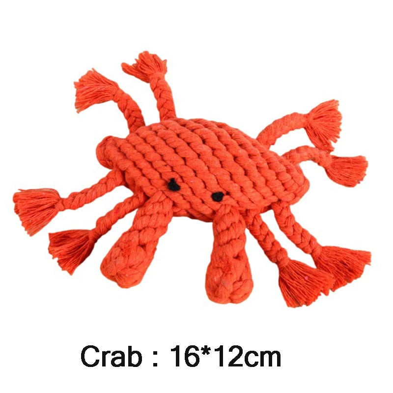 Bright orange crab-shaped dog rope toy with frayed ends, designed for dental play and chewing.