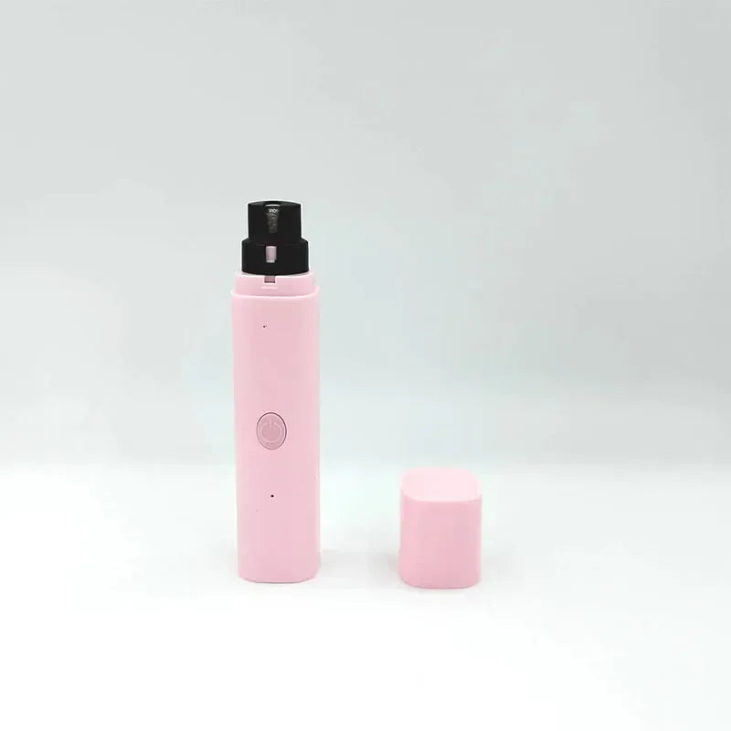 A sleek, pastel pink electric pet nail grinder with a black trimming head and a matching protective cap.