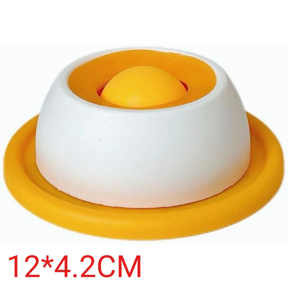 Round, white and yellow pet feeding bowl with a central ball feature, measuring 12cm by 4.2cm.