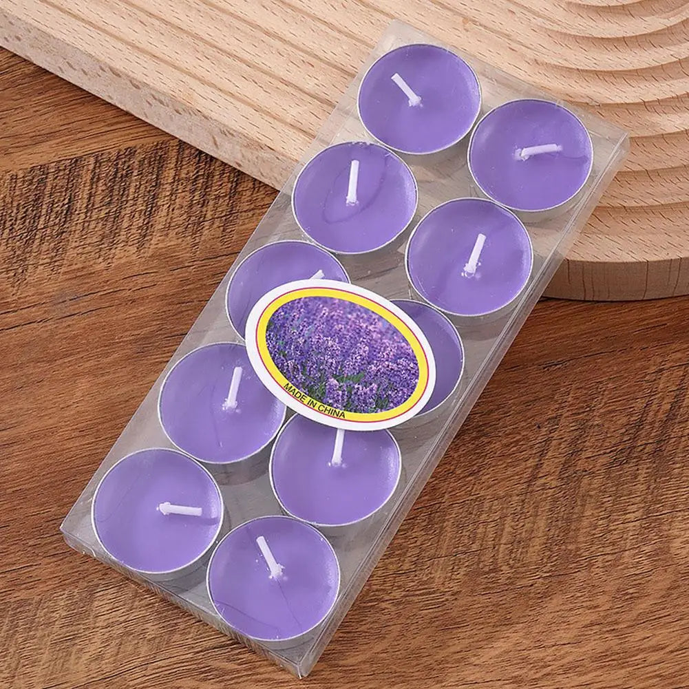 Pack of ten purple lavender-scented tea light candles in a clear plastic tray on a wooden surface.
