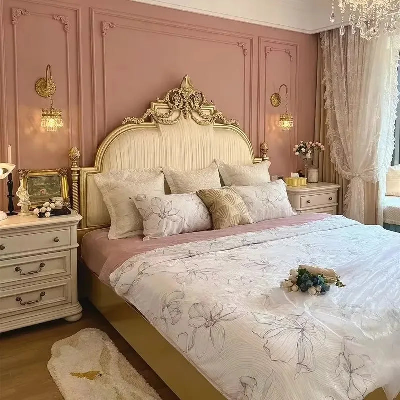 Italian princess-style double bed with ornate gold detailing, cream upholstered headboard, and elegant floral bedding.