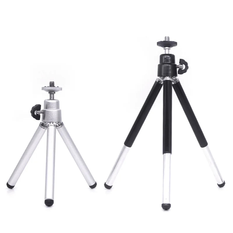 Two adjustable table-top camera tripods with screw mounts, one in silver and one in black and silver metal.