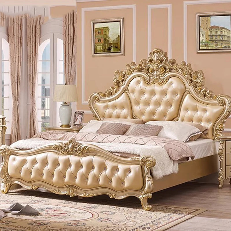 Luxury cream leather princess bed with gold ornate carved frame, crystal button tufting, and high Victorian headboard.