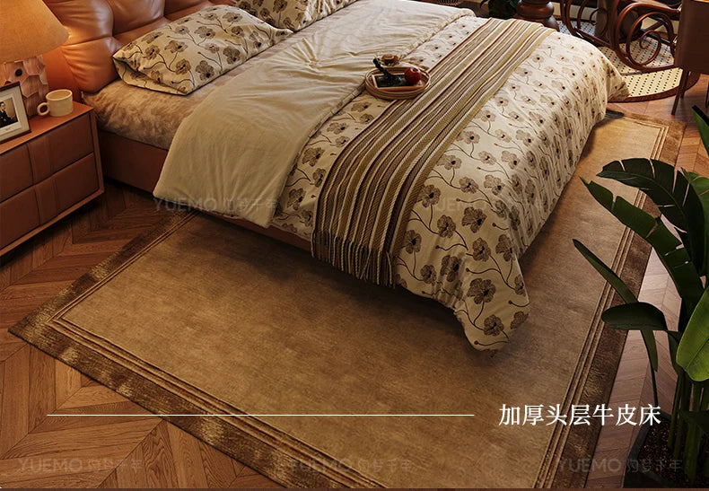 Modern Nordic double bed with a tan leather headboard, floral bedding, and a textured brown rug in a bedroom setting.