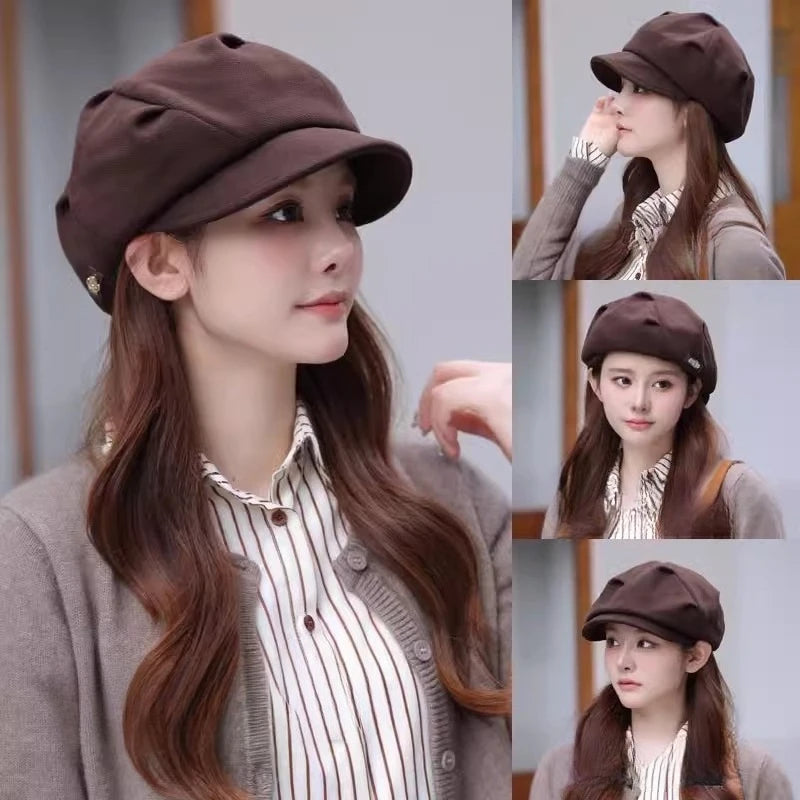 A woman wearing a dark brown, vintage-style newsboy beret hat with a structured peak and soft, gathered fabric crown.
