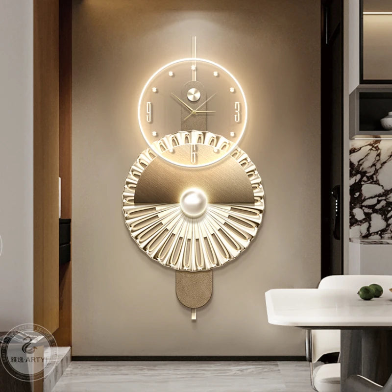 Modern gold-toned geometric wall clock with glowing LED ring, minimalist dial, and decorative fan-shaped base.