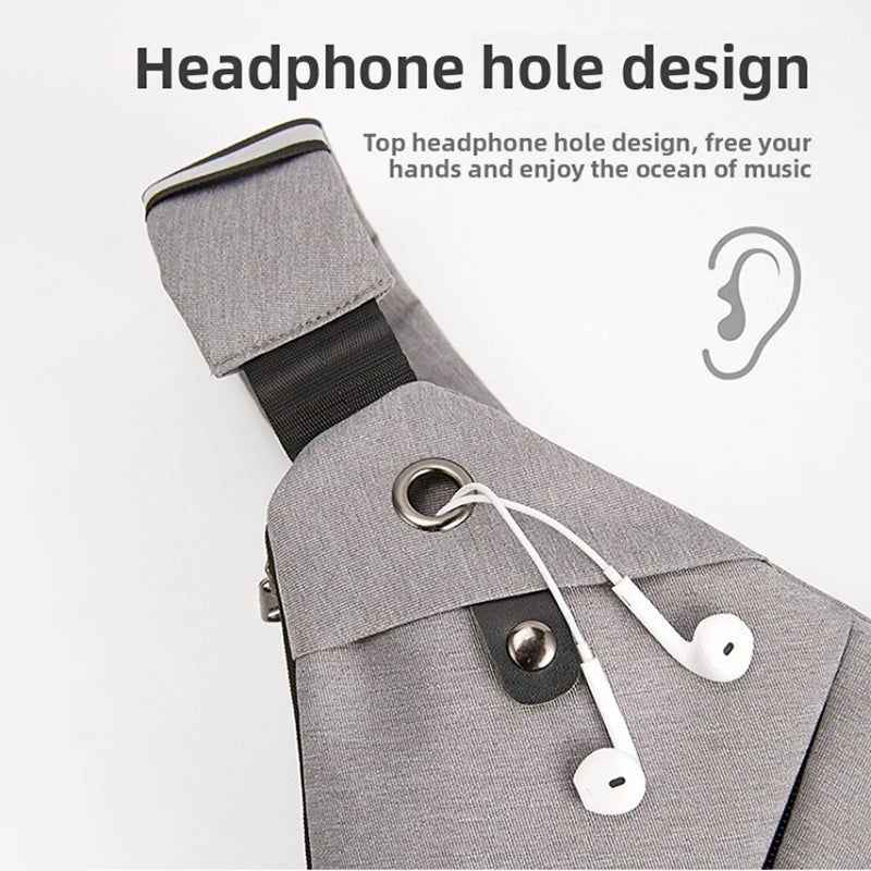 Grey, waterproof crossbody bag featuring a convenient integrated headphone cable port.