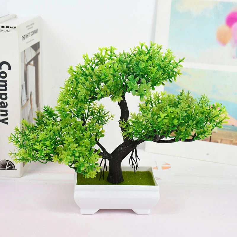Artificial bonsai tree with vibrant green leaves, a dark brown trunk, and roots in a white rectangular pot.
