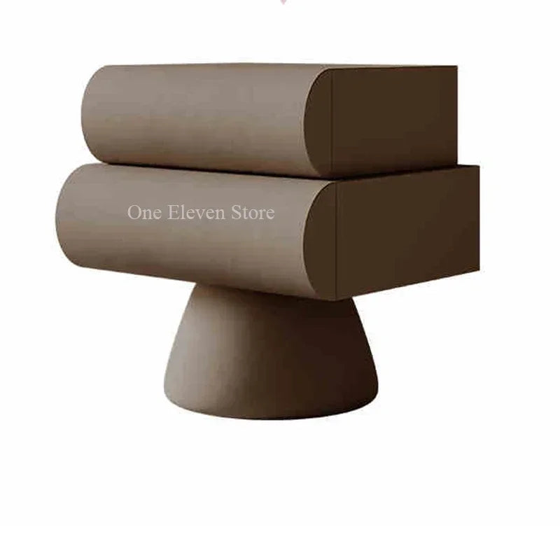 Modern taupe bedside table featuring two rounded drawers mounted on a minimalist pedestal base.
