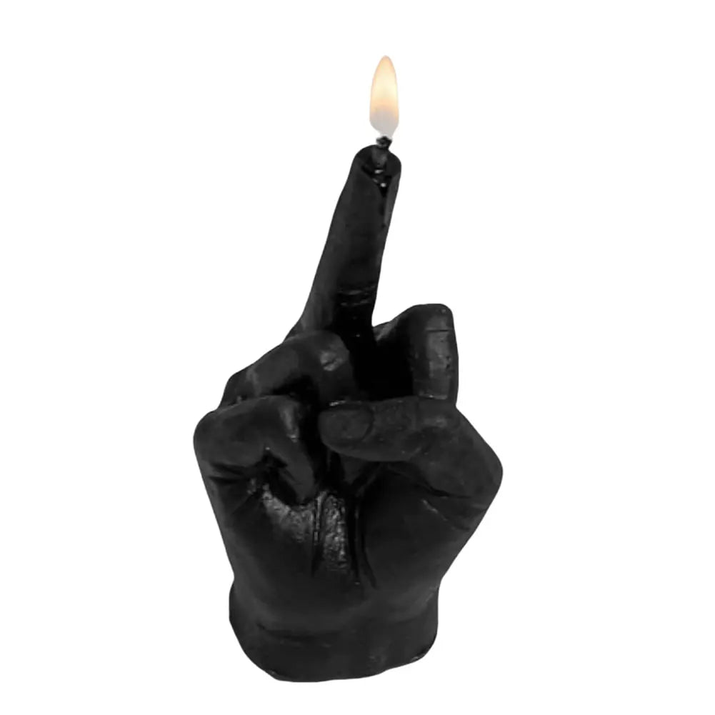 Black candle shaped like a hand making a middle-finger gesture, with a small lit flame on the extended finger.