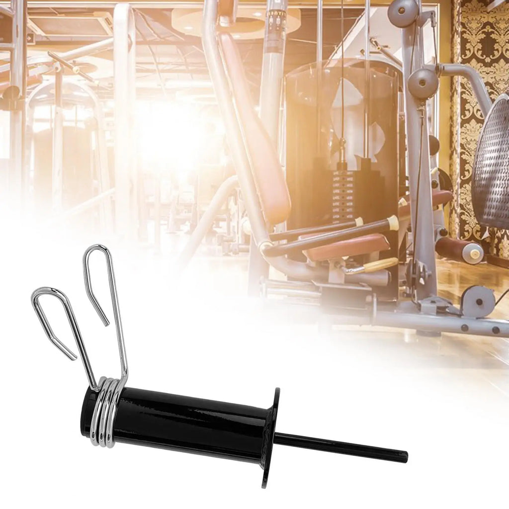 Black gym weight stack loading pin with a silver spring-loaded clip for secure plate attachment.