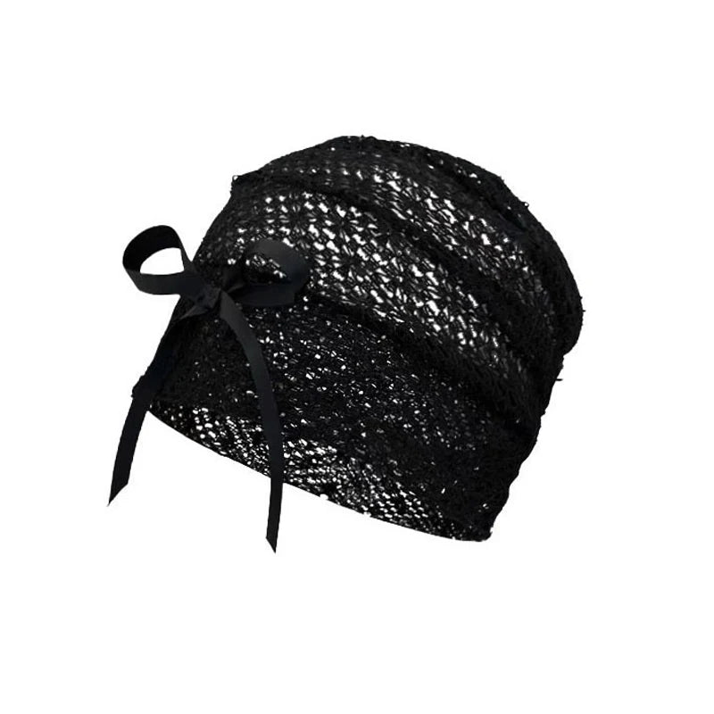 Elegant black crochet-knit beanie hat featuring a delicate side ribbon bow.