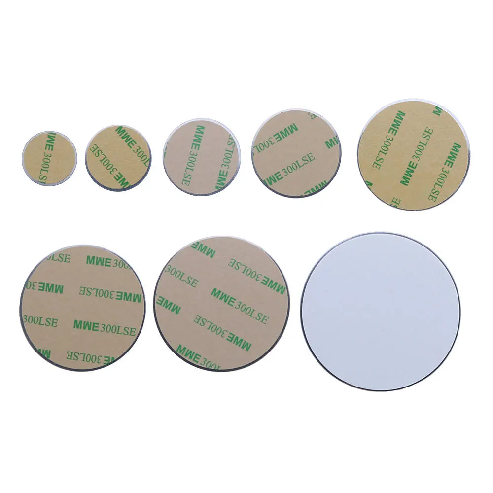 Set of eight circular adhesive pads of varying sizes, with light brown backing paper and green printed text.