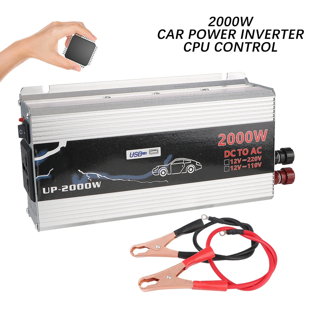 Silver 2000W car power inverter with USB port and red/black battery alligator clips on a white background.
