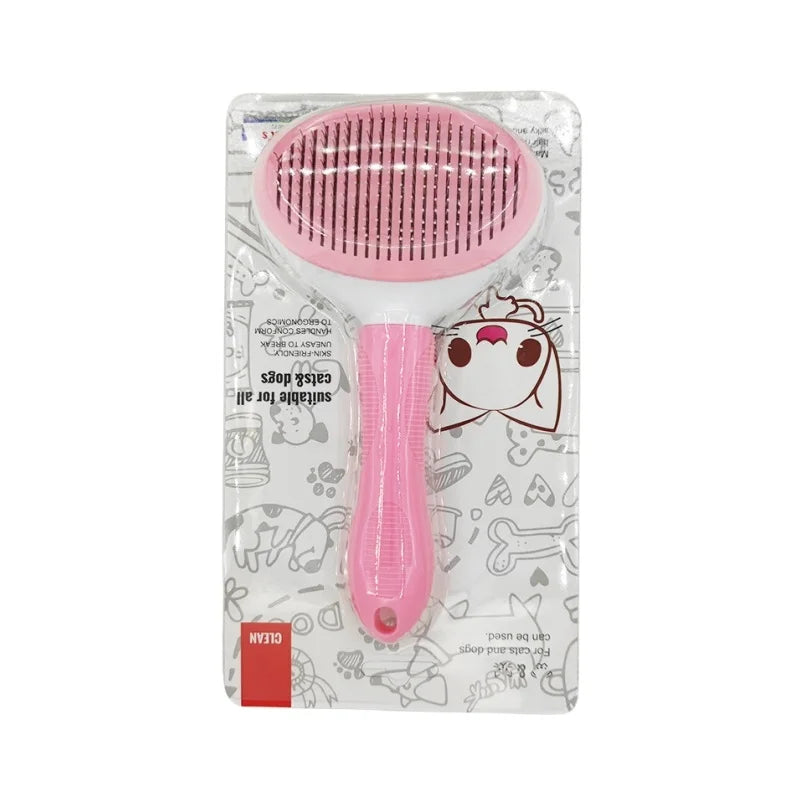 Pink pet grooming slicker brush with white handle in retail packaging with cat and dog illustrations.