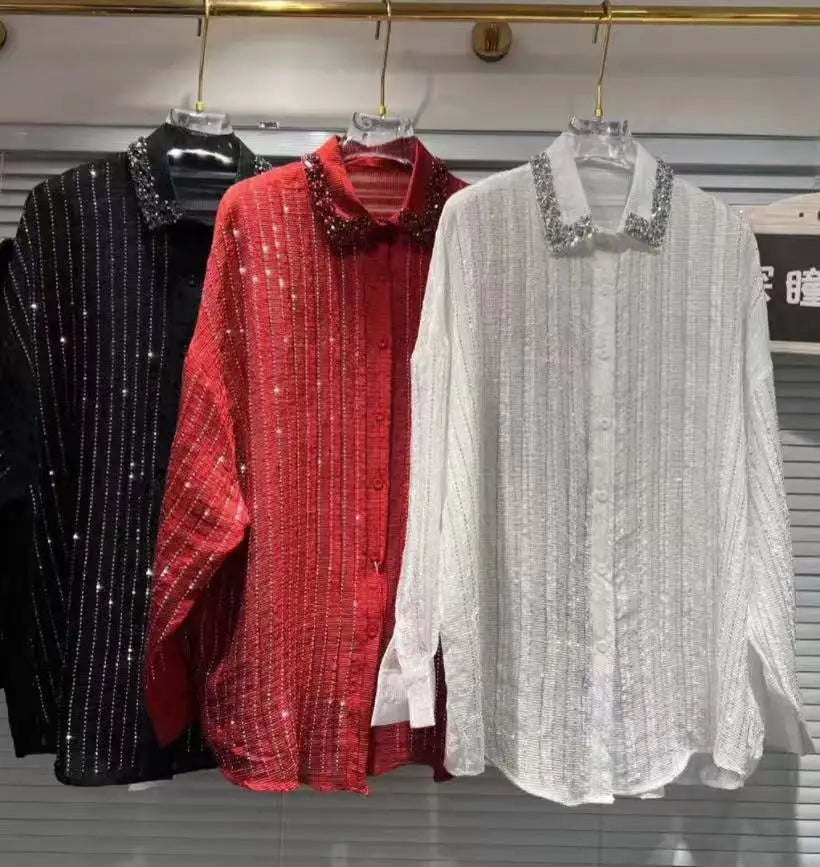 Three long-sleeved, button-up shirts in black, red, and white, featuring vertical glitter stripes and embellished collars.