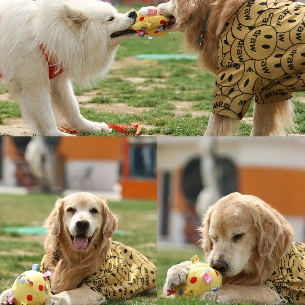Two dogs playing with a soft, yellow fleece ball featuring colourful animal patterns and fabric tags on a grass lawn.