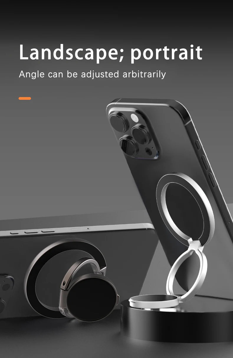 Adjustable silver circular ring stand attached to the back of a black smartphone for portrait or landscape viewing.