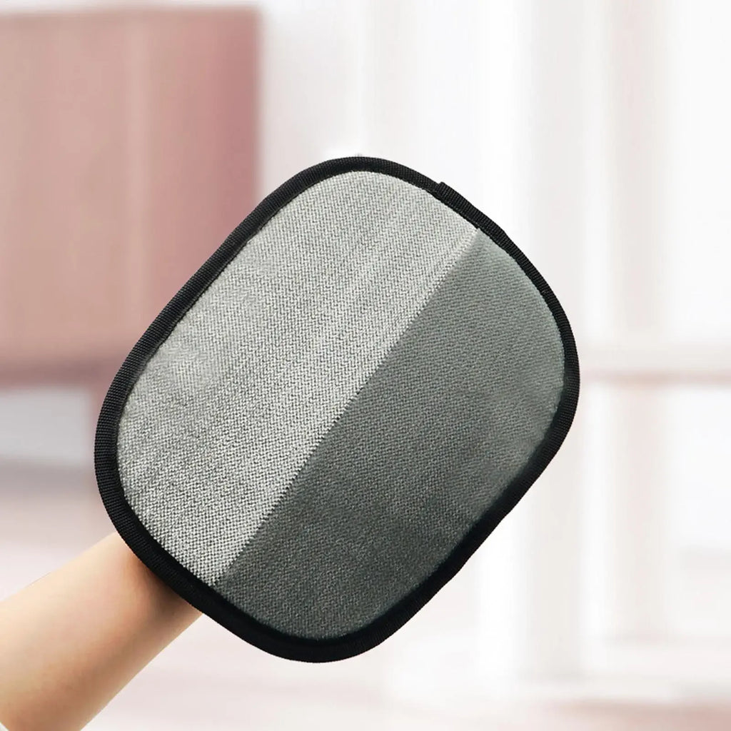 Oval cleaning mitt in two-tone grey with a black piped edge, being worn on a hand.
