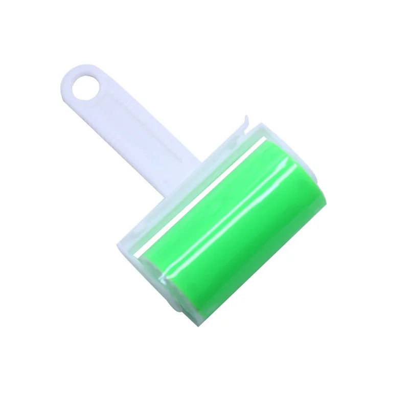 A reusable sticky lint roller with a bright green adhesive barrel and a white plastic handle with a hanging hole.