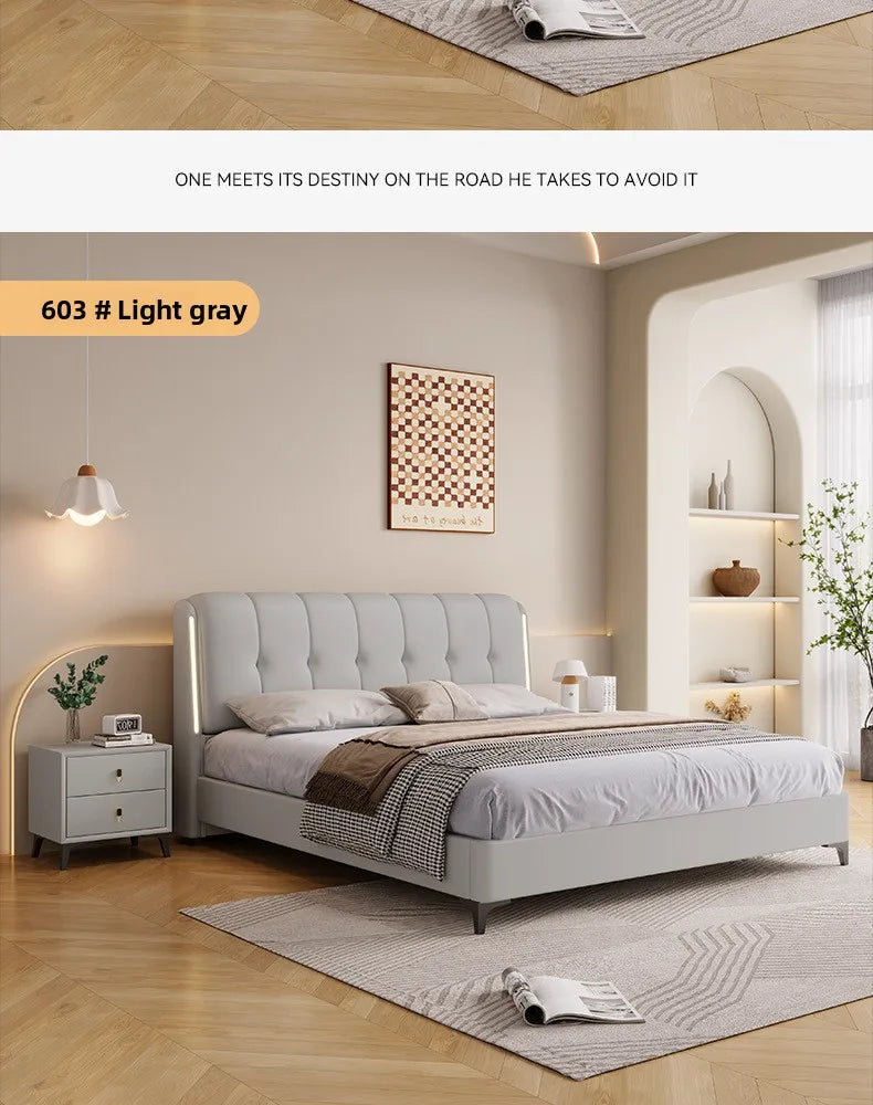 Modern minimalist light grey upholstered storage bed with a button-tufted headboard and integrated side lighting.