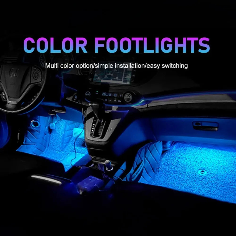 USB LED strip light kit installed in a car interior, casting bright blue ambient light on the footwells.