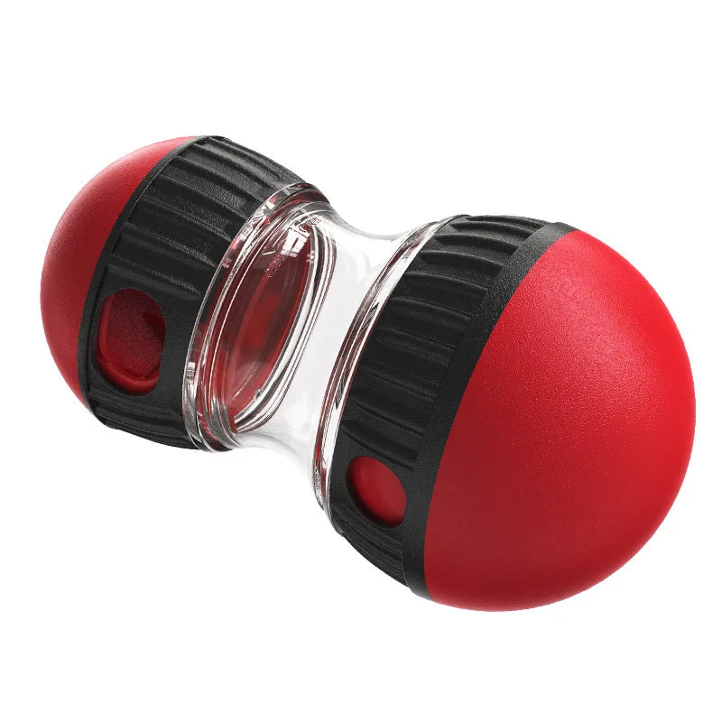 Red and black interactive dog treat dispenser toy with a transparent centre and textured grip.