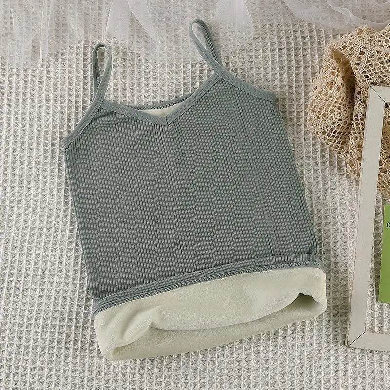 Sage green ribbed camisole with thin straps and a cozy, soft cream-coloured fleece lining.