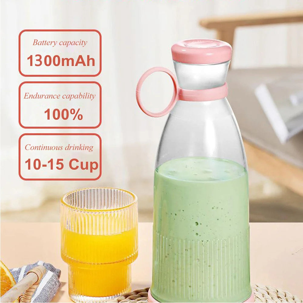 Portable pink and clear personal blender bottle filled with a green smoothie, next to a glass of orange juice.