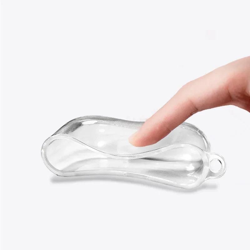 Flexible clear silicone AirPods case with attachment loop being held by a finger.