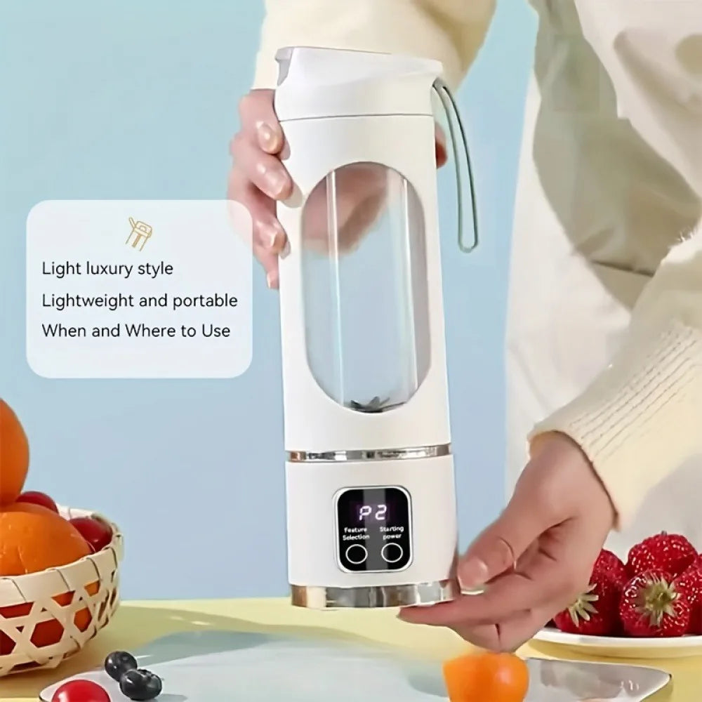 White portable electric blender bottle with a clear container, digital display, and carry strap on a pastel background.
