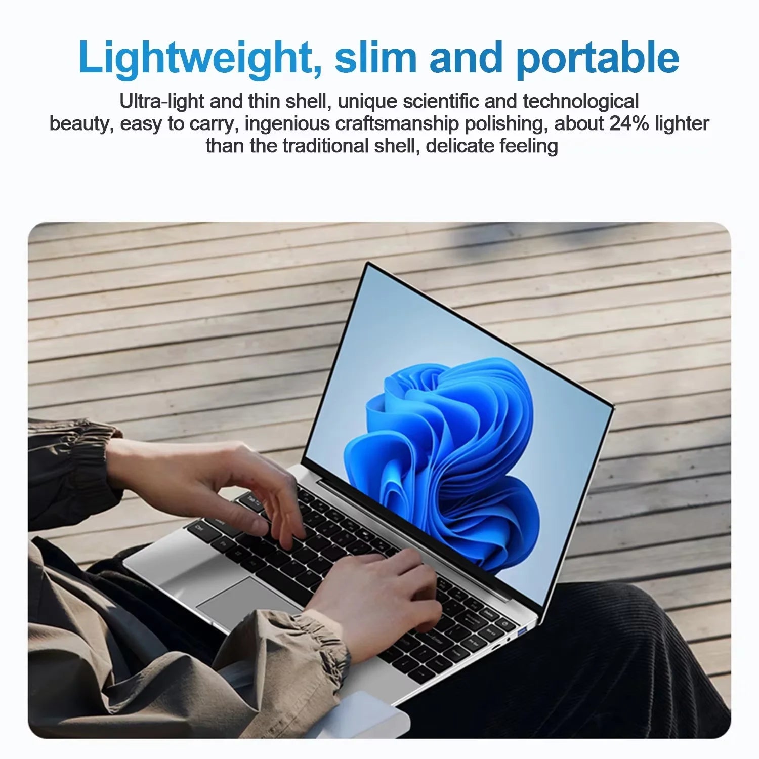 Slim silver 15.6-inch laptop with a modern, thin-bezel display showing Windows 11, held on a person's lap.
