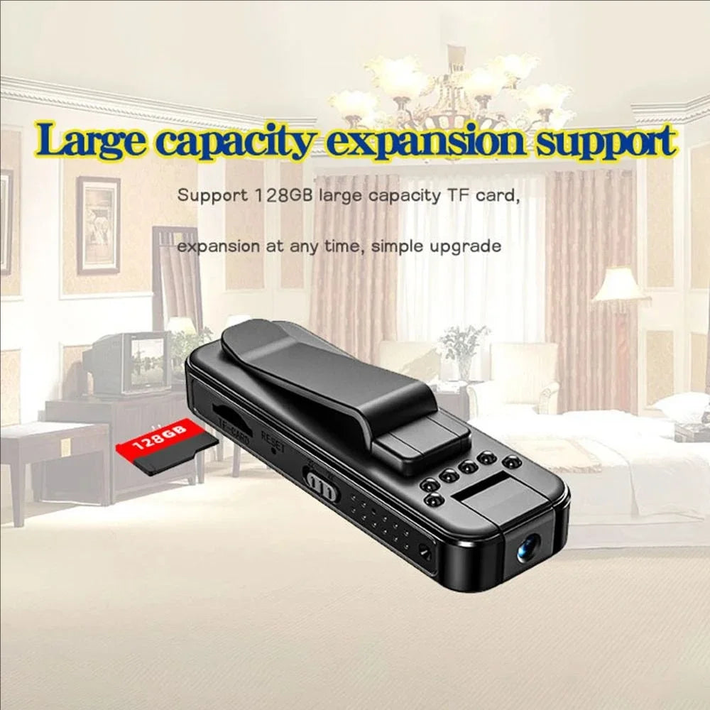 Black plastic portable camera with a clip, buttons, and a slot for a 128GB TF memory card.