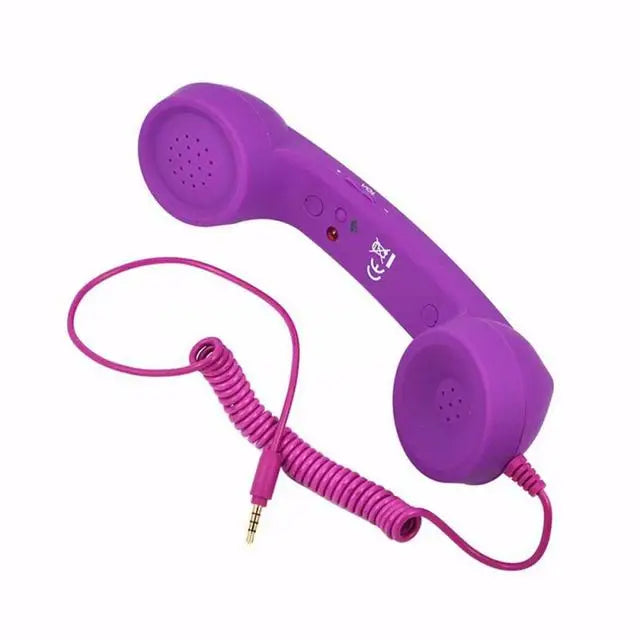 Bright purple retro-style telephone handset with a coiled cable and 3.5mm jack connector, set against a white background.