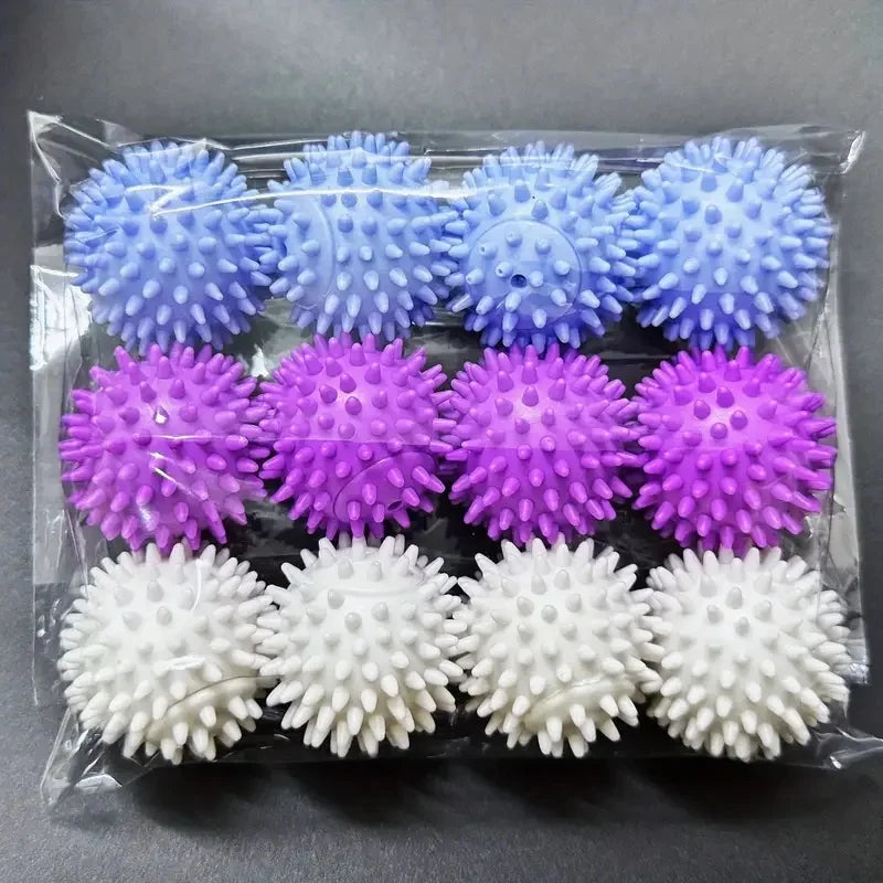 A clear plastic pack of 12 spiky massage balls in rows of blue, purple, and white.