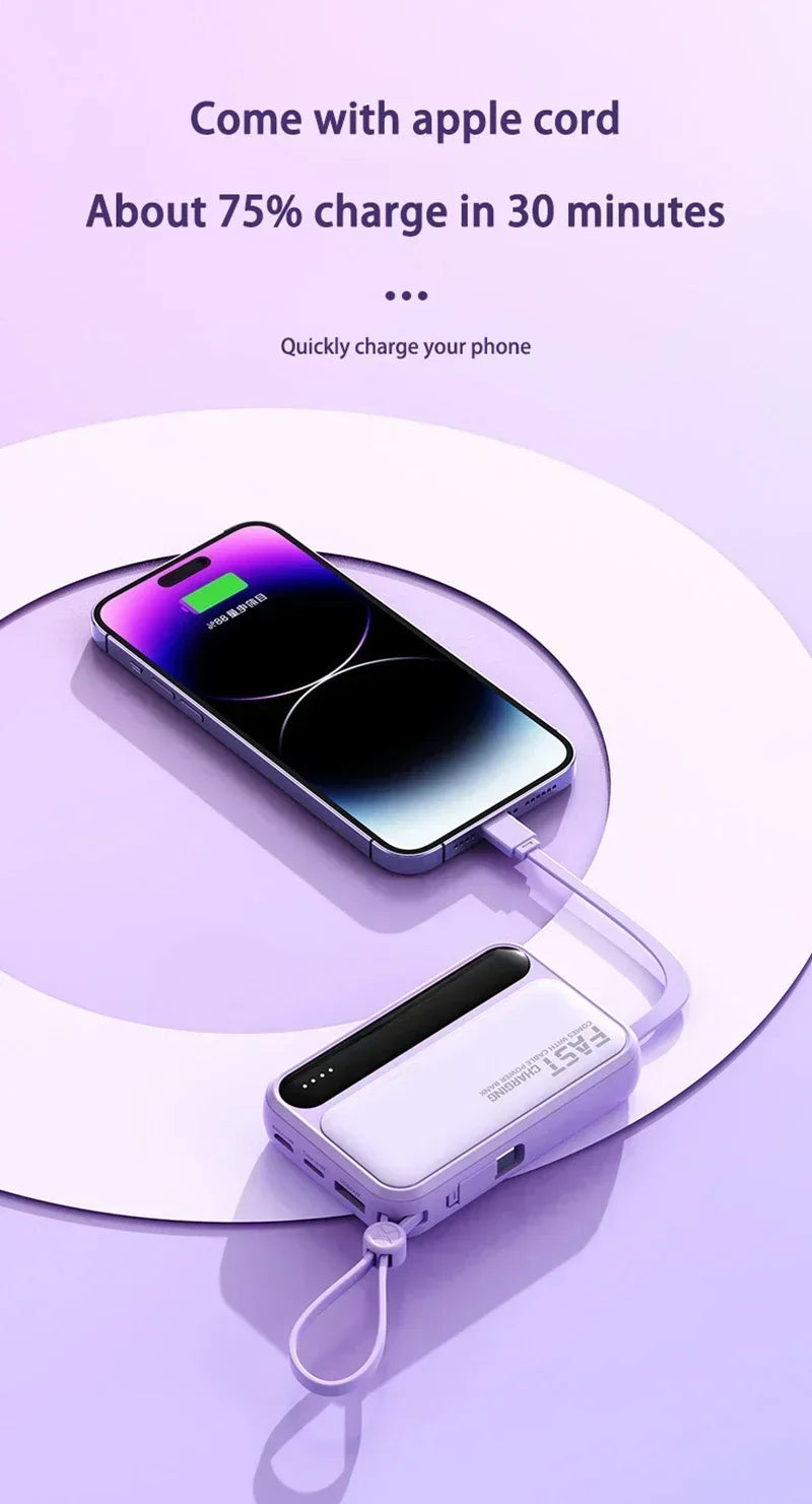 A compact, lilac portable power bank with a built-in charging cable, connected to a smartphone on a matching background.