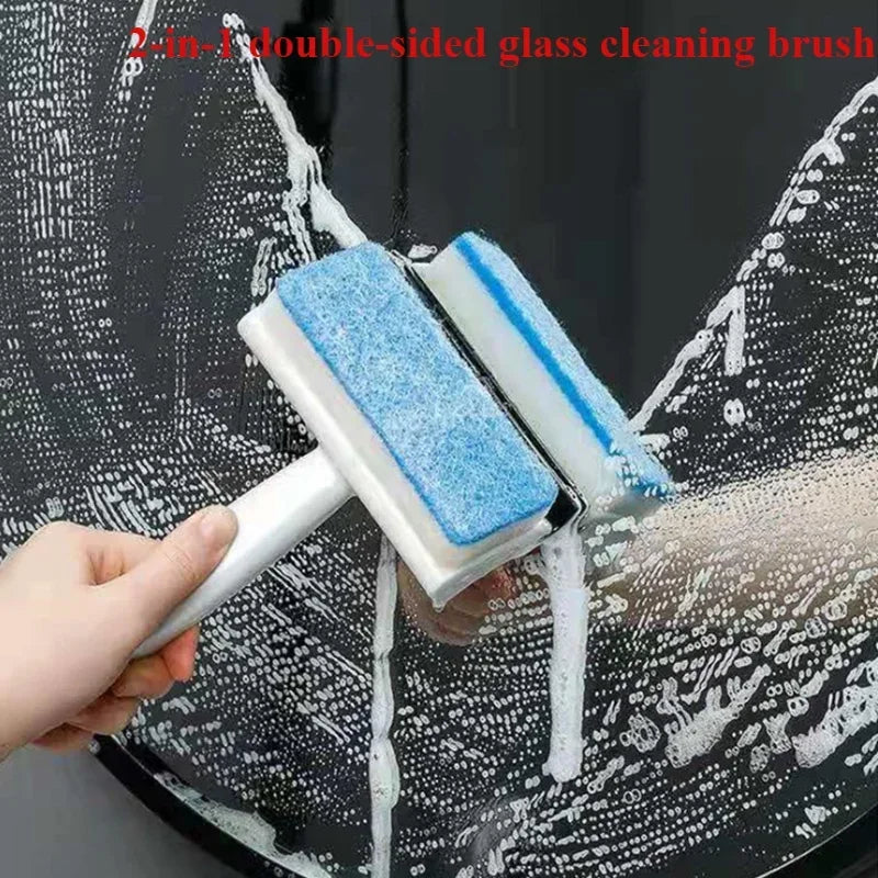 A white, 2-in-1 double-sided glass cleaning brush with blue sponges being used to scrub a soapy window.